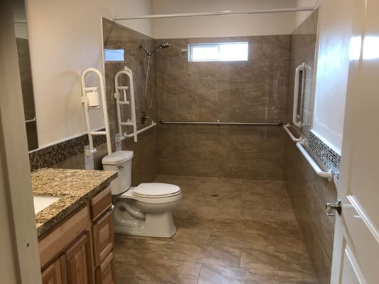 Accessible bathroom with grab bars and shower