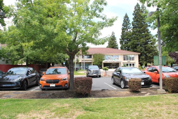 Exterior view of Mercy McMahon Terrace with parked cars