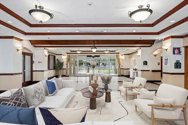 Bright and inviting lobby area with comfortable seating and decorative plants.
