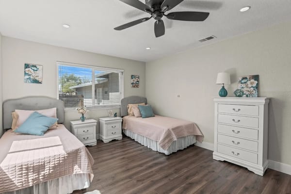 Cozy resident room with two beds and decor