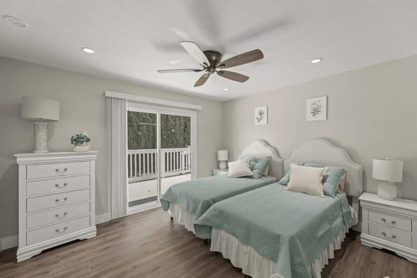 Bright and cozy twin bedroom with outdoor access