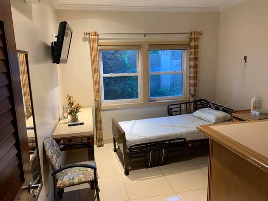 Private resident room with a bed and window