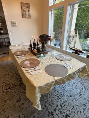 A beautifully set dining table in a common area