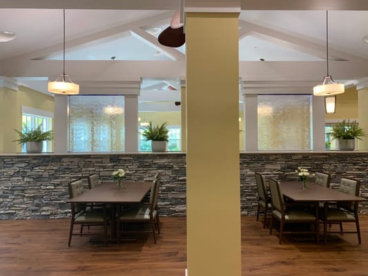Bright dining room with tables and chairs