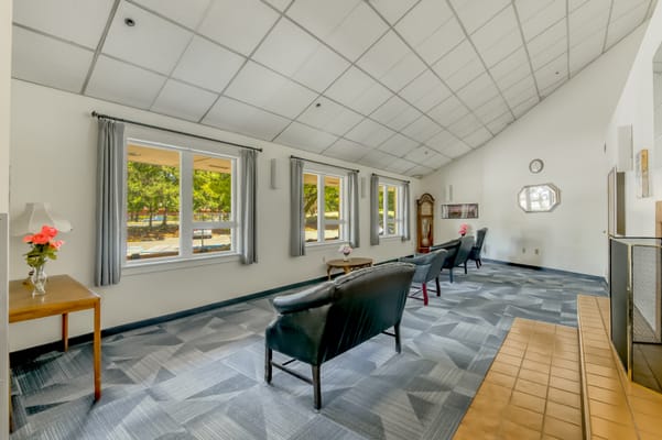 Bright common area with seating and windows.
