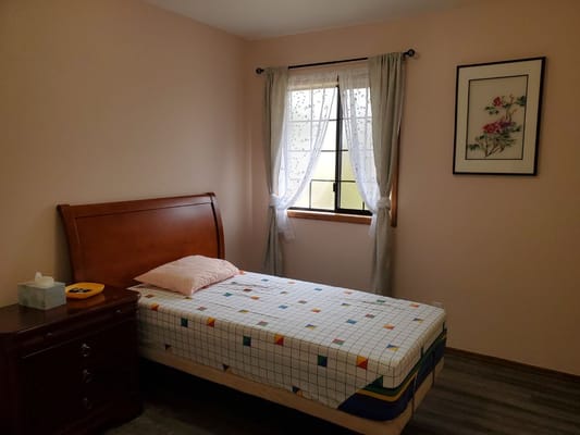 A simple bedroom setup in a senior living facility