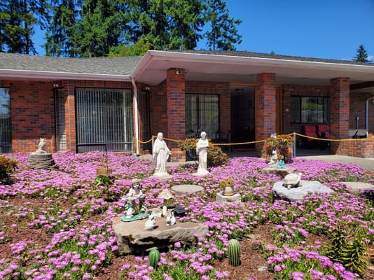 Beautiful outdoor landscaping with flowers and statues