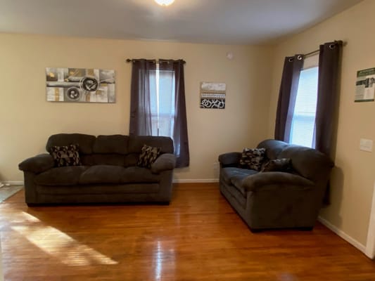 Living room with two sofas and art on the walls