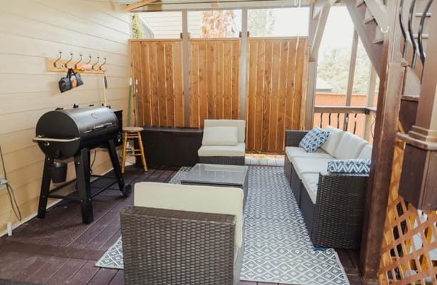 Cozy outdoor seating area with a grill