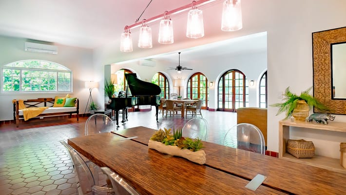 Inviting common area with piano and dining table at Lanihale