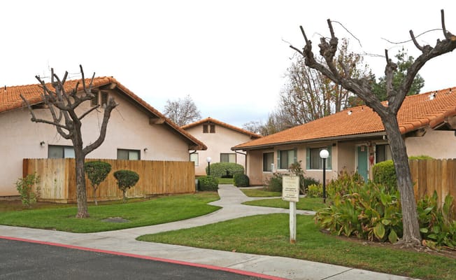 Outdoor view of two building structures with landscaped paths