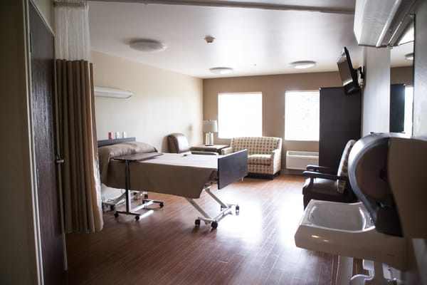 Private room in a nursing facility with a hospital bed