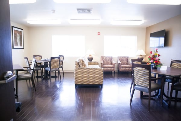 Bright common area with seating and tables