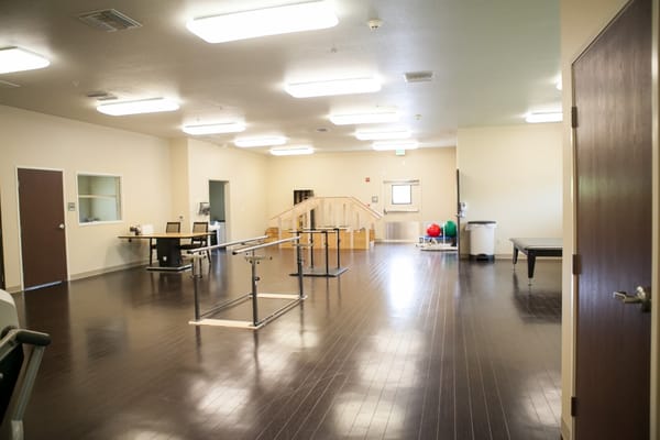 An interior view of a rehabilitation space with equipment