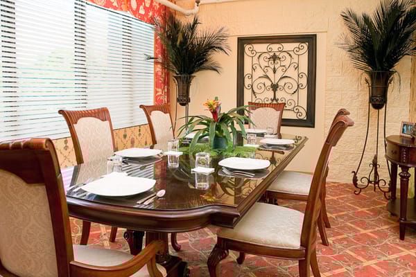 Elegant dining room setup with table and flowers