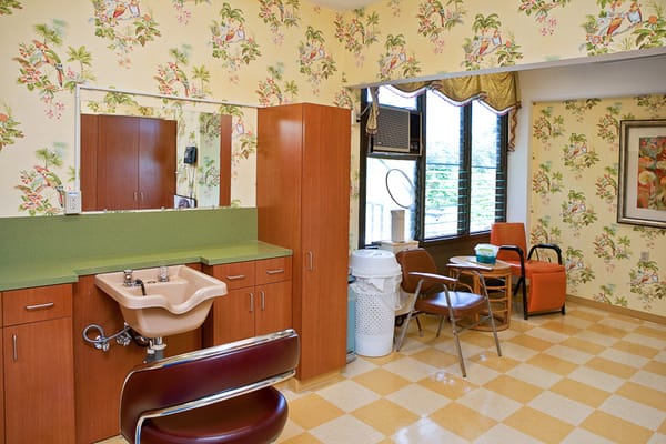 Interior view of a facility room with floral wallpaper