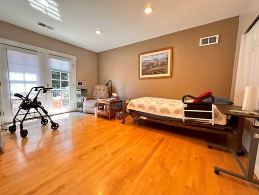 Private resident room with a bed and seating area