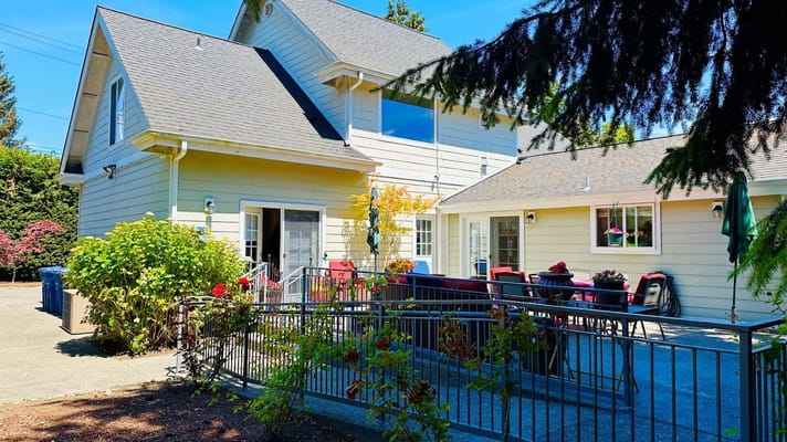 Exterior view of a senior living facility with a garden area