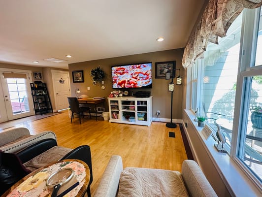 Bright common area with a TV and seating