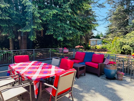 Outdoor patio area with seating and plants
