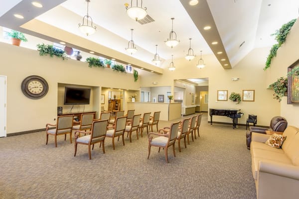 Spacious lobby with seating and piano
