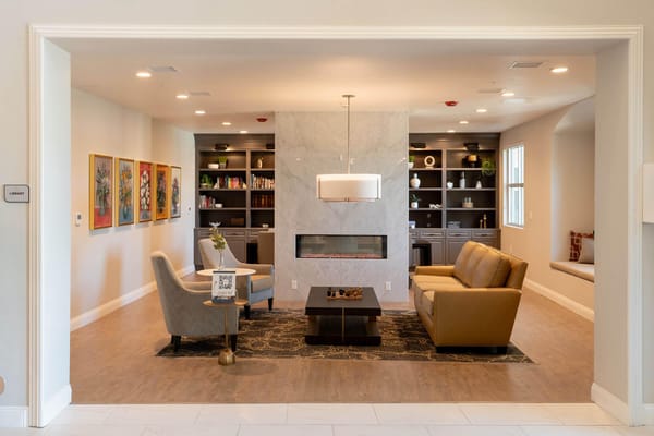 Cozy common area with seating and bookshelves