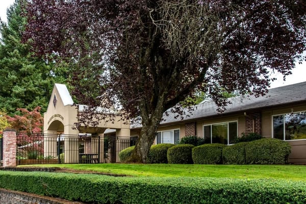 Exterior view of the facility entrance surrounded by greenery