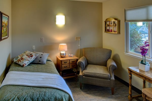 Cozy resident room with bed and seating