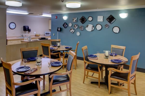 Dining area with tables and decorative wall plates