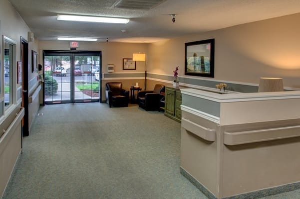 Interior view of a facility common area with seating