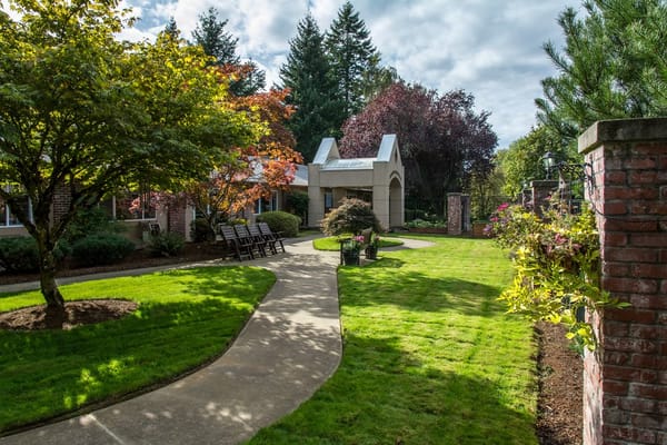 Well-maintained garden path with seating