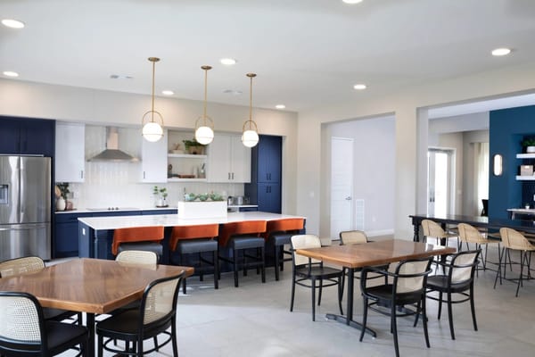 Spacious kitchen and dining area with modern decor and seating