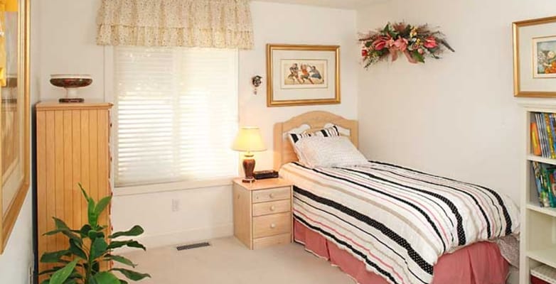 Cozy resident room with a bed and decor