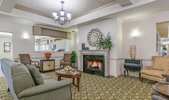 Cozy common area with seating and a fireplace
