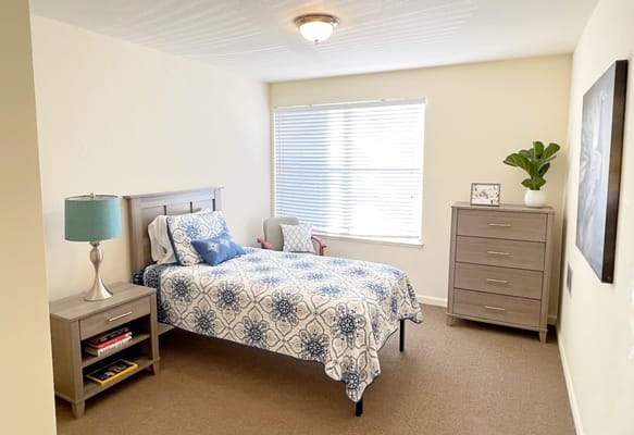 Cozy private bedroom in a senior living facility