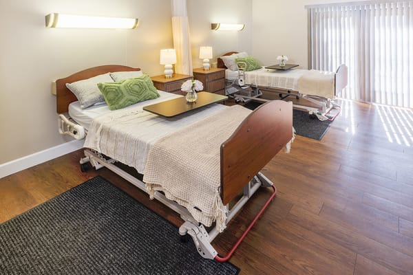 Interior view of a shared resident room with adjustable beds