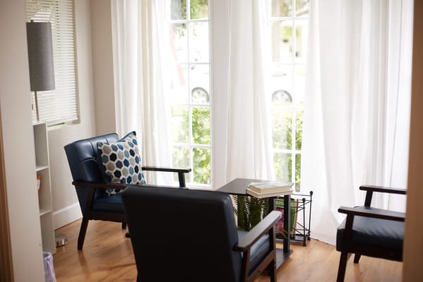 Cozy seating area with natural light and plants