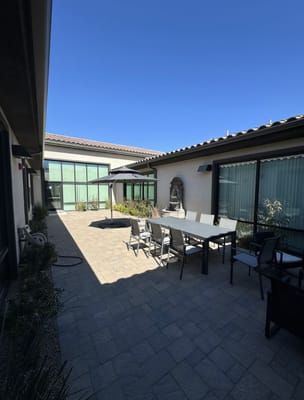 Outdoor courtyard area with seating and landscaping