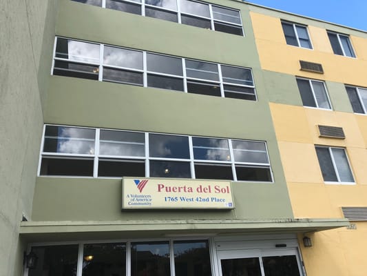 Exterior view of Puerta del Sol senior living facility.