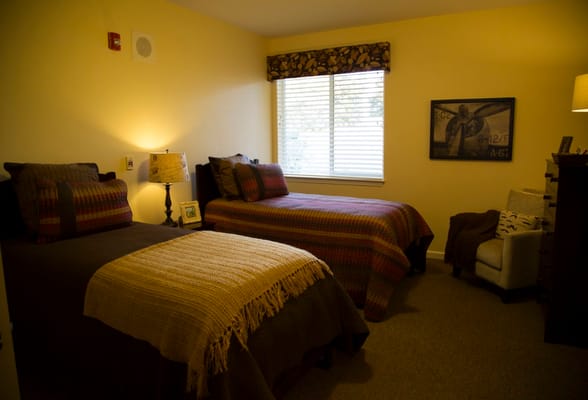 Cozy interior of a resident room with two beds
