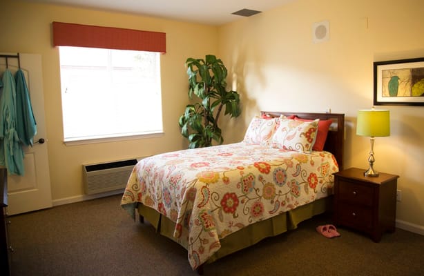 Cozy private room with bed and decor