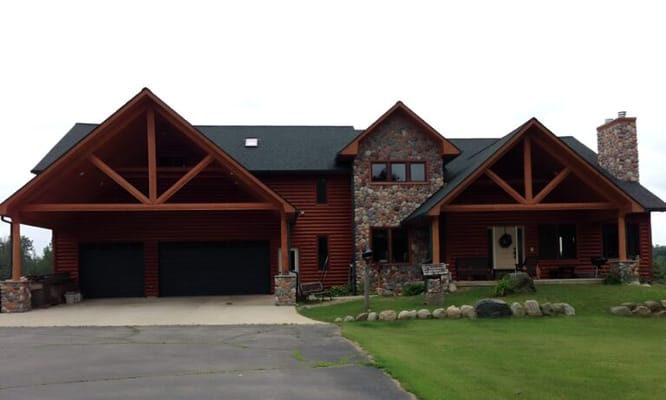 Front view of ShadowTree Lodge showing wooden and stone architecture