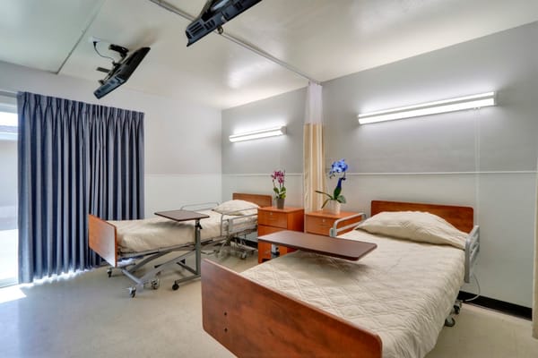 Interior view of a shared resident room with two beds