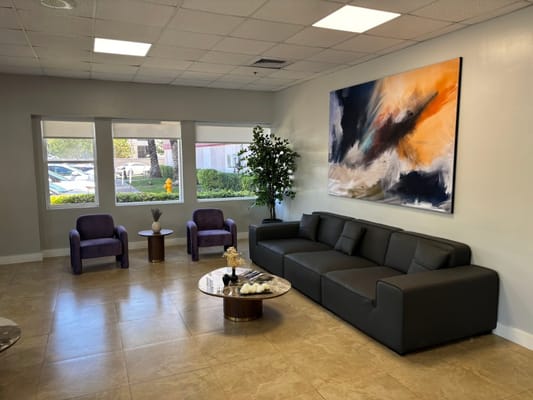 Interior lounge area with modern seating and artwork