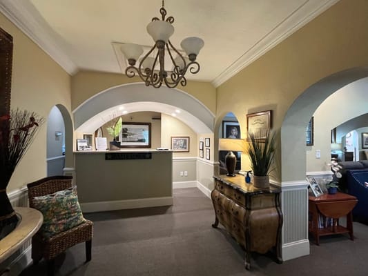 Indoor lobby area with a reception desk and decor