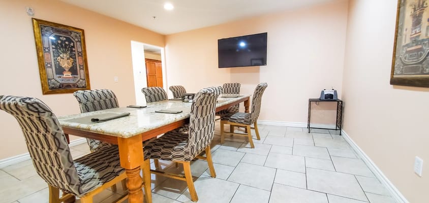 Dining area with a large table and chairs