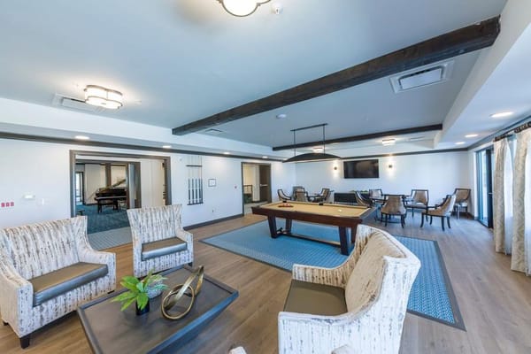 Cozy lounge area with seating and a pool table