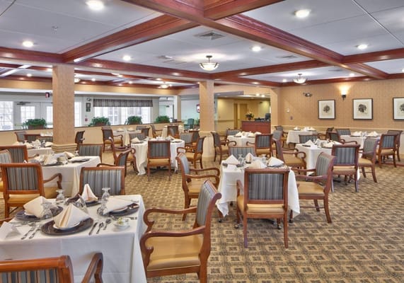 Elegant dining room with tables set for meals