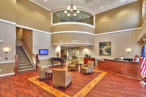 Welcoming lobby area with seating and staircase