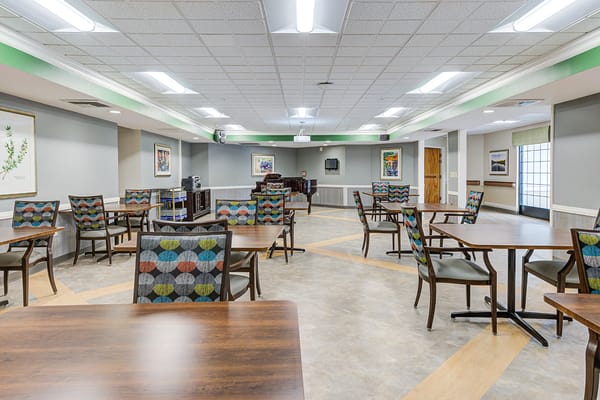 Bright dining room with tables and chairs